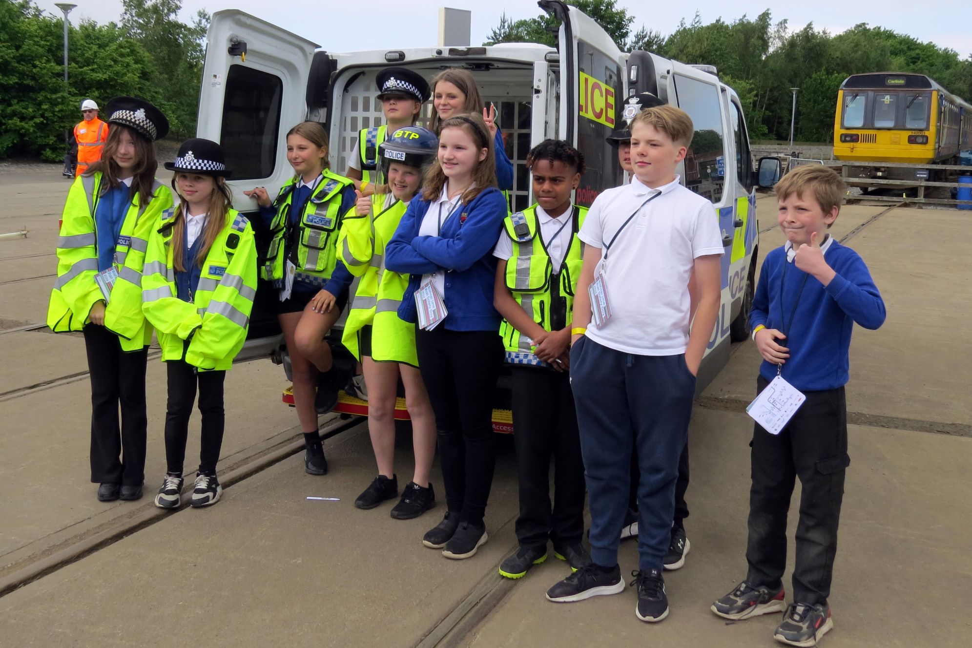 St George's CE Academy in front of the British Transport Police van