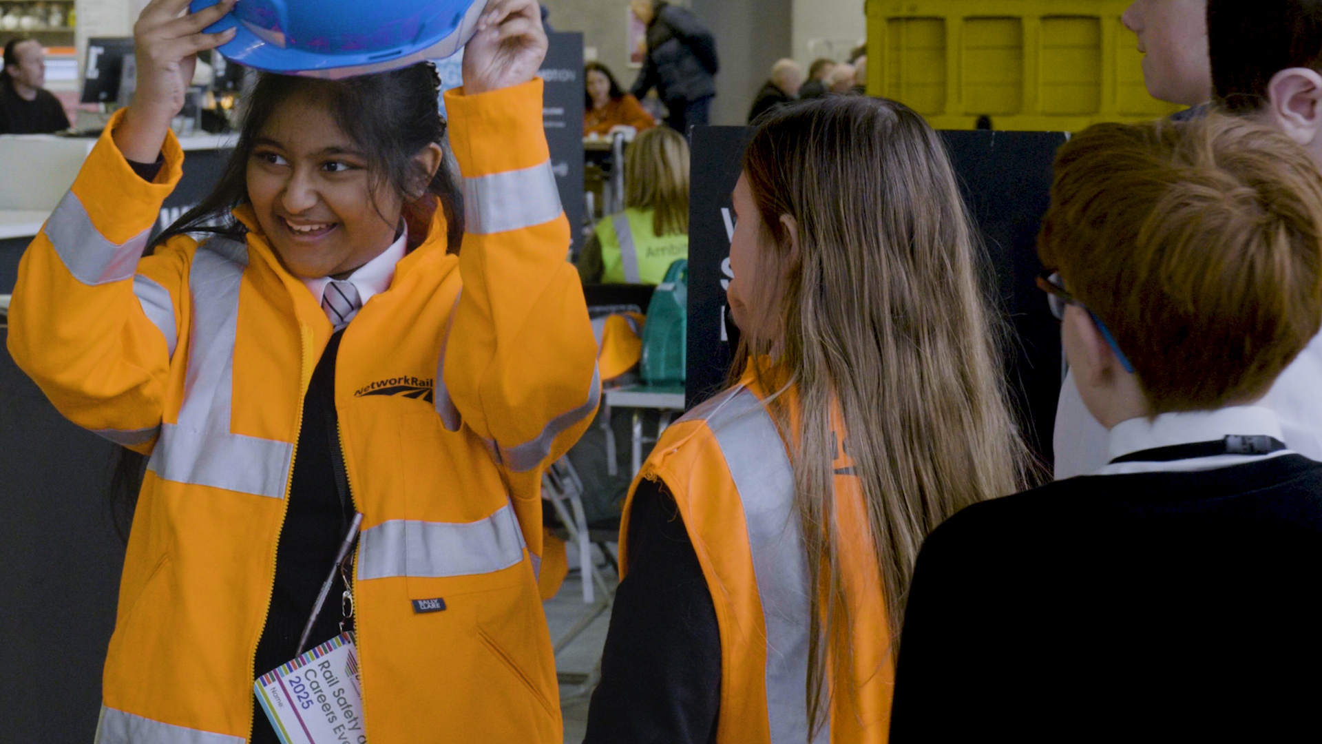 Students trying on Network Rail uniforms