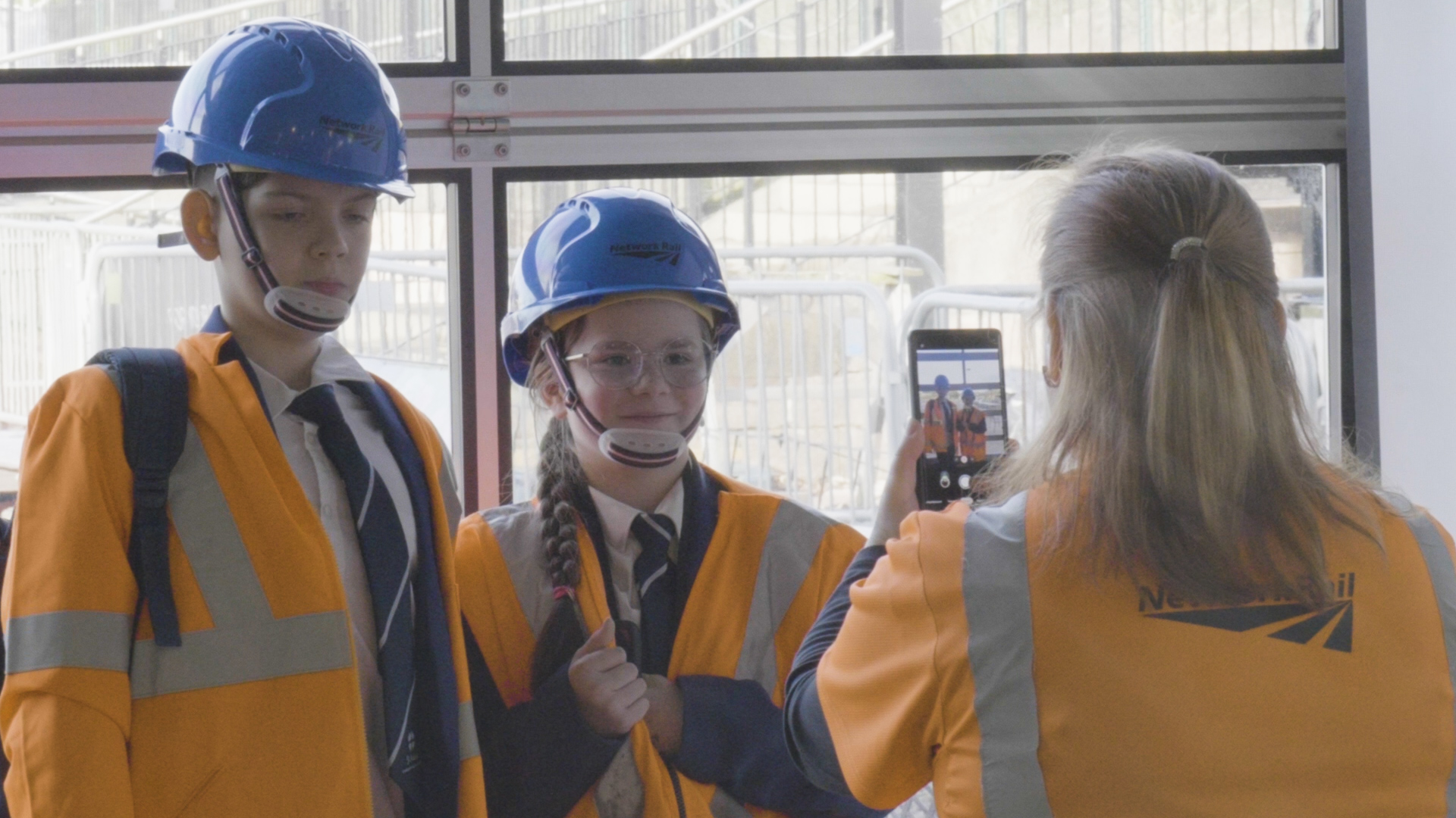 Students trying on Network Rail uniforms Students trying on British Transport Police uniforms