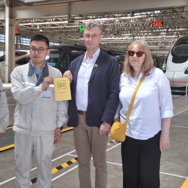 Niall and Caroline with S&DR200 festival programme at the Tangshan Locomotive Works.