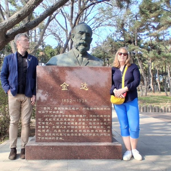 Niall and Caroline in Beihaide with the memorial to Claude Kinder.