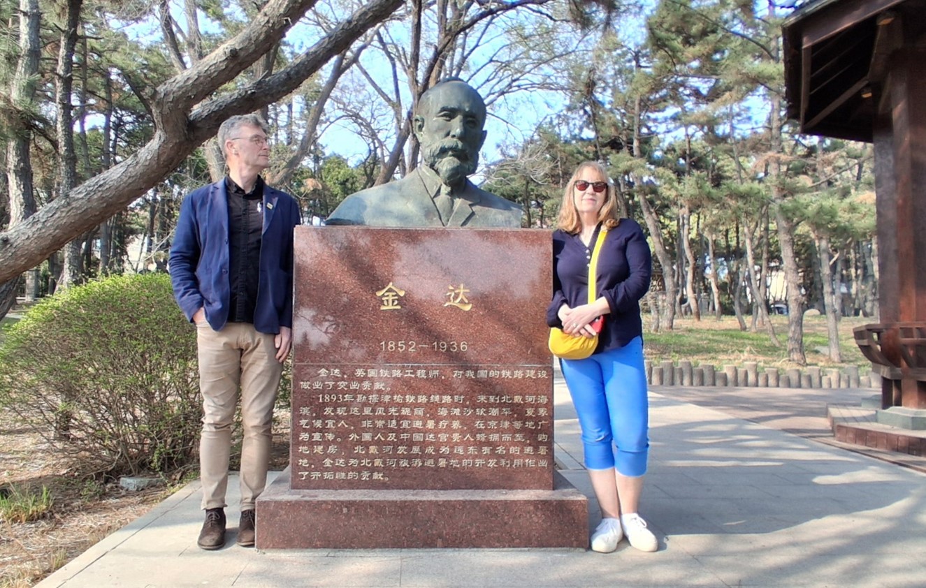 Niall and Caroline in Beihaide with the memorial to Claude Kinder.